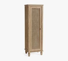 a tall wooden cabinet with rattan doors and drawers on the bottom shelf, against a white background