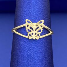 Be unique with this exquisite solid 10k yellow gold butterfly ring. Its minimalist design features wings that elegantly stick out, making it an eye-catching addition to any outfit. Make a statement with this beautiful and stylish ring. Metal: 10k Gold Type: Ring Size: 6 We size up to two sizes free of charge. Please contact us for pricing on resizing more than two sizes. We need 2-3 business days to resize this ring. We do not accept returns on resized and/or altered rings. We guarantee all mate 14k Gold Butterfly Ring For Anniversary, Gold 14k Butterfly Shaped Ring, Gold 14k Butterfly Ring, Yellow Gold Butterfly Ring For Formal Occasions, Dainty Gold Butterfly Ring, Formal Yellow Gold Butterfly-shaped Ring, Formal Yellow Gold Butterfly Ring, Elegant Yellow Gold Butterfly Ring, Gold Butterfly Ring In Fine Jewelry Style