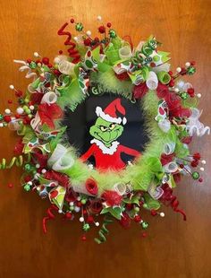 a christmas wreath with the grin face on it