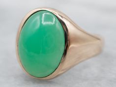 Originally designed for a man, this vintage ring is perfectly proportioned, and an excellent piece for a lady's hand, as well. We particularly like the curve of the undercarriage, making this super comfortable on the finger. Metal: 10K Yellow Gold Gem: Chrysoprase Gem Measurements: 15.7 x 12.0 mm, Oval Ring Size: 10 Marks: "HB 10K" Stamped on the inside band SKU #: A11668 Each piece has been identified and graded by a Graduate Gemologist who has been certified by the Gemological Institute of Ame Chrysoprase Jewelry, 10 Marks, Chrysoprase Ring, Green Stone Ring, Petite Earrings, Green Stone Rings, Ring Men, Cabochon Ring, Oval Ring