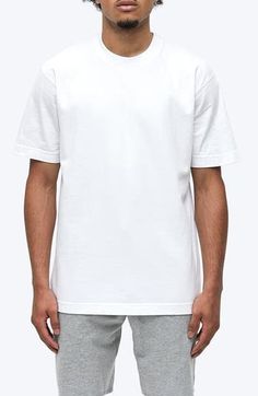 Exposed seams and a roomy, oversized fit define a T-shirt that's crafted for comfort from soft, midweight cotton jersey. 28" length (size Medium) Crewneck Short sleeves Smooth flatlock seaming designed to eliminate rubbing and irritation 100% cotton Machine wash, tumble dry Imported White Boxy Fit Crew Neck T-shirt, Sporty Relaxed Fit Cotton Jersey T-shirt, White Boxy Fit Urban T-shirt, Relaxed Fit T-shirt With Straight Hem For Everyday, White Cotton Crew T-shirt, Solid Drop Shoulder T-shirt For Streetwear, Solid Color Drop Shoulder T-shirt For Streetwear, Boxy Fit Drop Shoulder T-shirt, White Cotton Jersey T-shirt For Streetwear