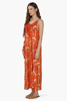 Palm foil print Maxi Dress with Spaghetti Straps Crochet Patch at Neck Cotton Tassel Detail at neckline and sides Princess A-Line Shaped Maxi Dress The Sunset Palm Foil Tassel Maxi Dress is a stunning and radiant piece that captures the essence of summer in every detail. Crafted from palm foil print fabric, this maxi dress embodies tropical elegance with its vibrant design and flowing silhouette. Featuring spaghetti straps, this dress offers a delicate and feminine look that is perfect for warm Foil Print Fabric, Leopard Bag, Feminine Look, Vibrant Design, Bag Dress, Foil Print, The Sunset, Hand Beading, Printed Maxi Dress