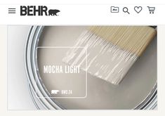 a paint can with a brush on top of it and the words mocha light above it