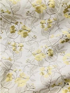 the fabric has yellow flowers on it