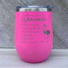 a pink wine tumbler that says, lessons to be a flamingo perfect balance long elegant neck tropical beauty stand out don't give a flock