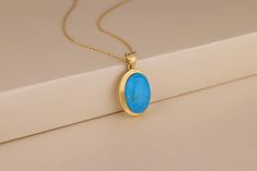 This simple turquoise pendant necklace is a great anniversary gift idea, birthday gift idea or Christmas gift! This piece of jewelry is made from genuine turquoise in 10K and 14K gold or sterling silver and will become her go-to piece of jewelry. Details of the product Material: 10K and 14K Solid Gold, Silver Gemstone: TurquoiseGemstone Gemstone Size: 12x16 mm Unique Gift For people whom you love; Mom, Girlfriend, Wife, Fiance, Best Friend; Dainty Gift Idea; Valentine's Day Gift, Birthday Gift, Anniversary Gift, Gift For Engagement or Wedding, Promise Gift, Christmas Gift, Black Friday Gift, Mother's Day Gift, International Women's Day Gift, Memorial Gift. By gifting this elegant product to the most special person in your life, you can make them very happy and I am sure that you will have Blue Stone Pendant, Woman In Gold, Blue Stone Necklace, Blue Opal Necklace, Silver Turquoise Jewelry, Turquoise Pendant Necklace, Perfect Blue, Formal Outfits, Mothers Necklace