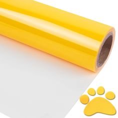 a roll of yellow vinyl next to a paw print