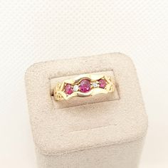 DESCRIPTION: A stunning antique Edwardian solid 18k 750 yellow gold ring, in great condition. The ring is mounted with 3 x genuine rubies and 2 x diamonds, all in an old cut style. The ring is fully hallmarked for 18ct 750 gold, dating to 1901. It weighs approx. 3.48g and sizes approx. at UK M or US 6.25. The overall condition is good and the shank is still lovely and thick. Mountains of unique antique and vintage pieces in our shop!  **FREE worldwide shipping on all items. Fill your boots **Ple Ruby Diamond Ring, Ruby Diamond Rings, Jewelry Post, Unique Antiques, Ruby Diamond, Yellow Gold Ring, Multi Stone Ring, Vintage Pieces, Multi Stone