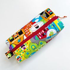 Fun handmade boxy zippered pencil case. Makes a great gift for kids or for the kid at heart to be used as a pencil case or anything else you may need a pouch for! Made with quality canvas and quilting cotton inside. Pouch is fully lined and washable. Wash cold water and light dry. Warm iron. Pencil case measurements 9 inches long 3.5 inches deep3 inches bottom width Please note there is no tracking for free shipping. If you want your items tracked you must let me know before purchasing. I can’t Pencil-shaped Pouch With Zipper Closure As Gift, Pencil-shaped Zipper Pouch Pencil Case For Study, Pencil-shaped Zipper Pouch Pencil Case For Organization, Epi Pen, Rectangular Zipper Pouch Pencil Case For On-the-go, Versatile On-the-go Pencil Case With Zipper, Boxy Pouch, Benjamin Bunny, Reusable Snack Bag