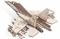 a wooden model of a fighter jet on a white background