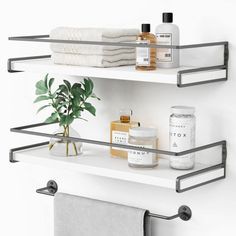 two metal shelves with towels and other items on them