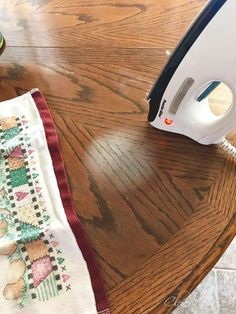 an ironing board and some fabric on a table