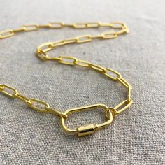 Oh yes, this necklace is so perfectly on trend friends. A chunky, yet not too heavy paperclip chain connected to a unique carabiner clasp. This necklace is ideal for wearing collar length and layering. Nickel free Precious metal plated brass Custom length [14" - 22" | 36 - 56cm] Clasp width [approx. 1" | 25mm] Proudly handmade in the USA Arrives gift boxed Trendy Link Chain Necklace With Lobster Clasp, Trendy Paperclip Chain Necklace With Lobster Clasp, Trendy Paperclip Necklace With Lobster Clasp, Everyday Toggle Necklace With Paperclip Chain, Trendy Link Toggle Necklace With Lobster Clasp, Trendy Toggle Link Necklace With Lobster Clasp, Everyday Chain Link Necklace With Lobster Clasp, Everyday Toggle Necklace With Chunky Link Chain, Everyday Oval Link Necklace With Carabiner Clasp