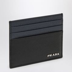 Cardcase By Prada In Blue/Black Saffiano, Featuring Six Card Slots, A Central Slot And Metal Lettering Logo With Silver Finish On The Front. Width 10 Cm X Height 7 Cm X Depth 0,5 Cm Size Type: Int Material: Leather Sku: 2f-2mc0252fpj/P_prada-F0g52_100 Welcome To The Official Luosophy Poshmark Closet! Luosophy Is A Luxury Brand Reselling Company Founded In San Diego, Ca From 2016. All Our Products Are Imported From Italy And Sold In The Usa. We Do Our Best To Provide High Fashion, Luxury Items At Modern Black Card Holder For Formal Use, Modern Black Card Holder For Formal Occasions, Modern Black Formal Card Holder, Luxury Black Card Holder With Card Slots, Designer Black Saffiano Leather Wallets, Elegant Blue Card Holder For Formal Use, Elegant Blue Card Holder For Formal Occasions, Designer Black Card Holder With Rfid Blocking, Classic Black Saffiano Leather Wallet