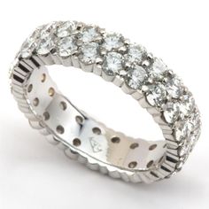 A double row of excellent cut diamonds graces the finger in this versatile ring that can be worn as a stunning right hand ring or an eternity diamond wedding band. 48 Round Diamonds = 3.10 carats tw F Color / VS Clarity 18K White Gold 5.0mm wide Weighs 5.5 grams Size 6 1/2 Made in USA Also available in Platinum, Gellow Gold and other sizes Chanel Set, Right Hand Ring, Diamond Eternity Band, Right Hand Rings, Hand Ring, Eternity Band Ring, Diamond Wedding Band, Eternity Band Diamond, Diamond Eternity