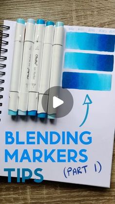 a notebook with markers on it and the words blending markers tips part 1 written in blue ink