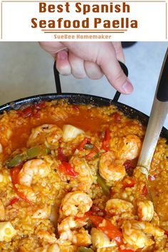 a skillet with shrimp and rice in it