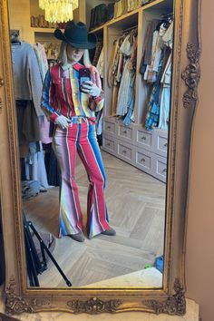 Looking for a cool outfit that will make you stand out? Check out this fun Western look with a bold striped matching set! Style it with a modern cowboy hat and Western boots and get ready to make a statement. Perfect for a country concert, music festival, or weekend occasion, this unique red, pink, blue, and yellow set has got you covered! Striped Set Outfit | Western Outfits Women | Funky Outfits | Nashville Outfits | Hunter Premo Outfits Nashville, Hunter Premo, Cowboy Boot Outfits, Outfit Western, Striped Set, Modern Cowboy, Casual Weekend Outfit, Wrangler Cowboy Cut, Nashville Outfits