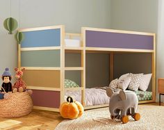 a child's bedroom with bunk beds and toys on the floor in front of them