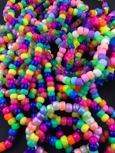 Add that finishing touch to any rainbow outfit with some rainbow kandi!  Select as many as you would like and we will send you a random assortment of the styles pictured here.  If you have a preference between pastel and neon let us know and we will keep it in mind. But please note the assortment s random Rainbow Beaded Bracelets For Friendship, Handmade Multicolor Stretch Bracelet For Party Favors, Multicolor Beaded Friendship Bracelets For Rave, Rainbow Beaded Bracelets For Rave And Friendship, Handmade Multicolor Beaded Bracelets For Party Favors, Rainbow Beaded Bracelets For Friendship Rave, Rave Style Multicolor Beaded Friendship Bracelets, Trendy Multicolor Plastic Friendship Bracelets, Multicolor Plastic Beaded Bracelets For Friendship