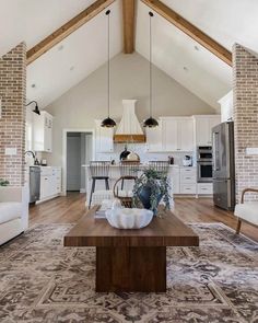 a living room filled with furniture and a wooden table