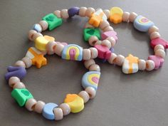 several colorful beads are arranged on a table