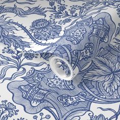 a blue and white wallpaper with an intricate design on the back side of it