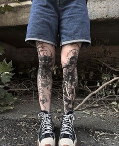 the legs and ankles of a person with tattoos on them