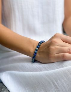 Lapis lazuli is a powerful stone for spiritual growth and enlightenment. This bracelet is designed to help you connect with the wisdom and power of lapis lazuli, and to promote your ongoing spiritual growth. The beautiful blue color of the stone is said to be associated with the divine, and wearing it can help you access your inner guidance and intuition. Adjustable Blue Lapis Lazuli Bracelet, Adjustable Blue Lapis Lazuli Bracelets, Sapphire Lapis Lazuli Bracelets With Round Beads, Adjustable Lapis Lazuli Beaded Bracelets With Gemstone, Everyday Blue Gemstone Beads Stretch Bracelet, Sapphire Lapis Lazuli Bracelets As Gift, Everyday Blue Stretch Bracelet With Gemstone Beads, Blue Lapis Lazuli Gemstone Beaded Bracelet, Adjustable Blue Lapis Lazuli Beaded Bracelets