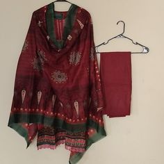 Top Fabric Linen Color Maroon Size 42 Inches In Chest 42 Inches Hips 3/4th Sleeves Round Neck Laced Sleeves And Bottom Of The Kurta Pants Straight Elastic Waist Band Linen Fabric Dupatta 86 Inches Long Width 46 Printed Cotton Silk Churidar With Printed Motifs For Navratri, Traditional Drape Salwar Kameez With Printed Motifs In Jamawar, Traditional Jamawar Salwar Kameez With Printed Motifs, Red Semi-stitched Lawn Suit For Transitional Season, Jamawar Anarkali Set With Printed Motifs For Diwali, Festive Cambric Traditional Wear With Printed Motifs, Red Unstitched Lawn Suit For Transitional Season, Festival Salwar Kameez With Printed Motifs, Festive Jamawar Salwar Kameez With Printed Motifs