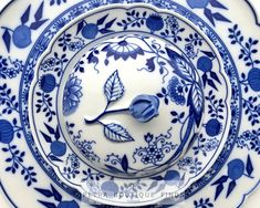 a blue and white plate with flowers on it