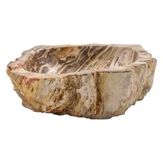 a wooden bowl that is shaped like a tree stump, with some brown and white streaks on it