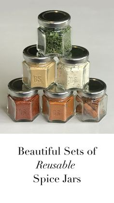 a stack of spice jars with the words beautiful sets of reusable spice jars