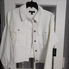 I Have A White Inc Trucker Jean Jacket Size Medium. New With Tags! 98% Cotton. 2% Spandex. Measurements In Pictures! Great Spring/Summer Jacket With Jeans Or Capris Or Your Favorite Summer Dress. Thx For Looking. White Utility Jacket With Button Closure For Spring, White Casual Utility Jacket For Work, White Utility Jacket With Pockets For Fall, White Cropped Jacket With Pockets For Fall, White Collared Utility Jacket For Fall, Trendy White Button-up Outerwear, White Casual Utility Jacket For Fall, Trendy White Utility Jacket For Fall, White Cotton Cropped Jacket For Work