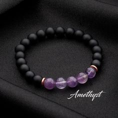 Matte Black Onyx and Amethyst * Amethyst Bracelet * Healing Bracelet * Crystal Bracelet * Gift for Him * Mens Bracelet * Bracelet Mens Jewelry * Bracelet for Women * Tigers Eye Bracelet * Gifts for Dad *  Christmas Gifts ✨Healing Properties of Our Gemstones✨ * Amethyst: A powerful protector, promoting calm and clarity. Excellent for meditation and spiritual growth. * Aquamarine: Soothes and calms, promoting clear communication. Also known for reducing stress and fear.  * Blue Turquoise: Offers protection and promotes inner calm. Enhances communication and spiritual growth.  * Carnelian: Boosts courage and confidence, stimulating creativity and motivation. * Citrine: Attracts prosperity and success, boosting self-confidence. Promotes joy and enthusiasm.  * Hematite: Promotes focus and conce Black Amethyst Bracelets With 8mm Beads, Black Amethyst 8mm Bead Bracelets, Black Amethyst Bracelet With 8mm Beads, Black Amethyst Beaded Bracelets Spiritual, Spiritual Black Amethyst Beaded Bracelets, Black Amethyst Beaded Bracelets, Black Amethyst Gemstone Beaded Bracelets, Black Amethyst Bracelet As Gift, Bracelet Christmas