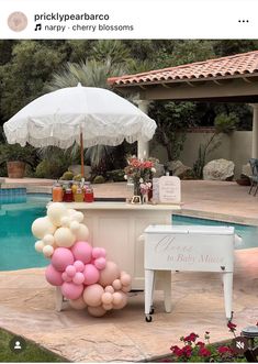 an outdoor bar set up with balloons and a white piano in the foreground, next to a pool