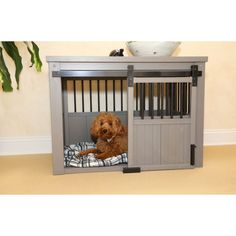 a dog is sitting in his kennel