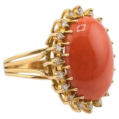 This is an exceptional, gorgeous Italian momo coral gold ring. It is surrounded with many diamonds to give it even more of a gorgeous sparkle. The color of the coral is natural and has not been dyed or processed like many other corals in the market. It has a nice dark red color better than the normal salmon or white color. The coral has a nice smooth luster feeling that shines at every angle. The gold purity on the ring is 14 karat. The quality on the diamonds ranges SI clarity from GHI color di Elegant Coral Rings For Anniversary, Coral Elegant Wedding Rings, Elegant Coral Wedding Rings, Coral Stone Ring, Coral Jewelry Vintage, Dark Red Color, Coral Ring, Coral And Gold, Coral Stone