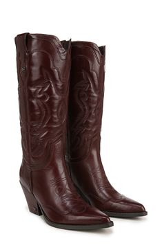 Decorative seams and tonal stitching add Western-inspired elements to a leather boot balanced by a pointy toe and stacked block heel. 2 3/4" heel 11" shaft; 14" regular calf circumference 11" shaft; 16" wide calf circumference Pull-on style Leather upper/synthetic lining and sole Imported Western Snip Toe Heeled Boots In Calf Leather, Western Calf Leather Heeled Boots With Snip Toe, Western Style Low Heeled Leather Boots, Western Calf Leather Heeled Boots With Pointed Toe, Western Leather Boots With Block Heel, Brown Western Style Heeled Boots With Pointed Toe, Brown Snip Toe Heeled Boots With Stacked Heel, Pointed Toe Boots With Leather Lining For Western-themed Events, Brown Heeled Boots With Leather Lining And Snip Toe