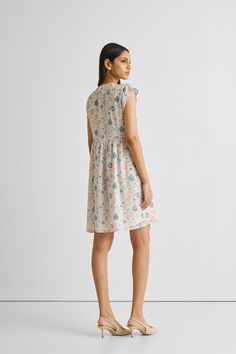 Elevate your summer style effortlessly with our 'Cap Sleeved Short Dress in Florals.' Crafted from 100% Bemberg™ Crepe, this dress embodies comfort and style. Designed for both ease and elegance, this dress has a regular fit complemented by comfortable cap sleeves and convenient pockets on both sides. Versatile for various occasions, this dress offers a perfect blend of chic florals and comfort, ensuring you stay cool and fashionable during the warmer seasons. Embrace the calming hues and breezy Relaxed Fit Viscose Dresses For Daywear, Floral Print Relaxed Fit Dress For Daywear, Relaxed Fit Floral Print Day Dresses, Relaxed Fit Viscose Dress For Day Out, Casual Viscose Mini Dress For Daywear, Floral Print Relaxed Fit Dress For Garden Party, Relaxed Fit Floral Print Dress For Garden Party, Viscose Short Sleeve Dress For Garden Party, Feminine Summer Dress With Relaxed Fit