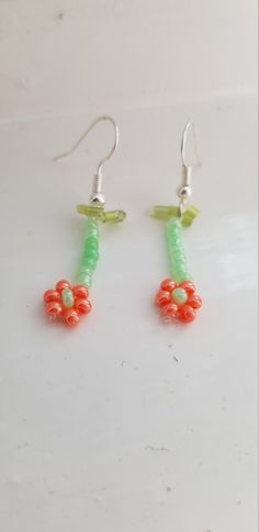 Custom made glass beaded flower earings. Summer Flower Earrings With Dangling Beads, Colorful Beads Flower Earrings As Gift, Flower Beaded Earrings With Flower Charm As Gift, Beaded Flower Earrings With Czech Glass For Gifts, Czech Glass Flower Earrings For Gifting, Green Flower Beaded Earrings For Gift, Gift Flower Earrings With Beaded Czech Glass, Czech Glass Flower Earrings For Gifts, Gift Beaded Flower Earrings With Czech Glass