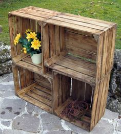 a wooden crate with some flowers in it