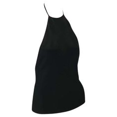 For Sale on 1stDibs - Presenting a black backless halterneck Gucci top, designed by Tom Ford. From the late 1990s, this incredible new with tags top is constructed of stretchy Goth Wardrobe, Gucci By Tom Ford, Gucci Runway, Gucci Top, Ford Black, Silk Knit, Halter Top, Tom Ford, Tops Designs