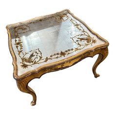 an ornate gold and white tray with flowers on it