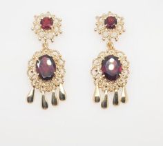 "Here we have a beautiful 14k yellow gold vintage earrings with garnet birthstones. Weigth: 8.6g. Length: 1 1/2\". Width: 1/2\". In excellent condition. The perfect gift for your loved one. Comes with a free gift box." Garnet Birthstone, Dangling Earrings, Fine Jewellery Earrings, Vintage Earrings, Free Gift, Garnet, Jewelry Earrings Dangle, Vintage Ladies, Dangle Drop Earrings