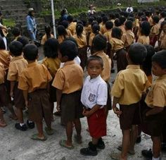 a group of young children standing next to each other