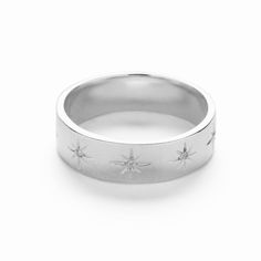 The Star ring features stars engraved along the band with Cubic Zirconia stone. The beautifully decorated ring looks great on its own or stacked with other rings. Match it with the star necklace or star earrings for a celestial look. Buy for yourself or as a gift. Silver Star-shaped Jewelry With Single Cut Diamonds, Celestial Star-shaped Jewelry For Anniversary, Celestial Star Jewelry For Anniversary, Adjustable Star-shaped Jewelry For Promise, Celestial Star-shaped Jewelry With Diamond Accents, Promise Jewelry With Star Shape And Diamond Accents, Silver Star-shaped Ring With Diamond Accents, Celestial Silver Jewelry With Single Cut Diamonds, Star-shaped Diamond Jewelry For Promise