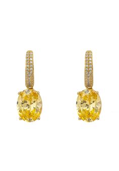 These exquisite Alexandra Oval Drop Earrings are the perfect way to add a touch of glamour to any outfit. These beautiful, handcrafted earrings are made from 925 sterling silver dipped in 18ct gold, the stunning lab-grown yellow topaz gemstones are offset by sparkling simulated diamonds set along the front edge of the latch back fastening to this earring, adding a touch of luxury to this already stunning piece. With a length of 2.6cm and 0.9cm wide and weighing 6.1g, the latch back fastening ens Gold Oval Hallmarked Diamond Earrings, Gold Oval Diamond Earrings, Hallmarked, Gold Oval Diamond Earrings For Gift, Gold Oval Cubic Zirconia Earrings, Gold Oval Earrings With Cubic Zirconia, Classic Yellow Oval Earrings, Gold Oval Diamond Earrings In Sterling Silver, Oval Gold Diamond Earrings In Sterling Silver, Elegant Oval Hoop Earrings With Gemstone