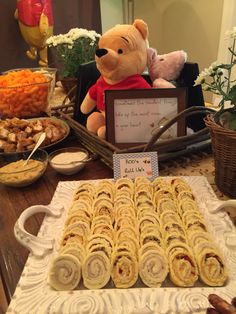 winnie the pooh birthday party food and treats on a table with a teddy bear