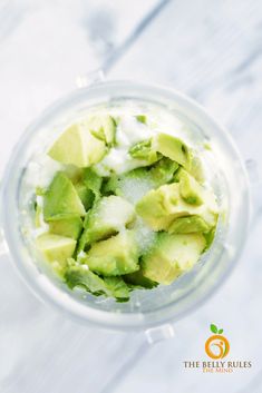 an avocado is in a blender with ice